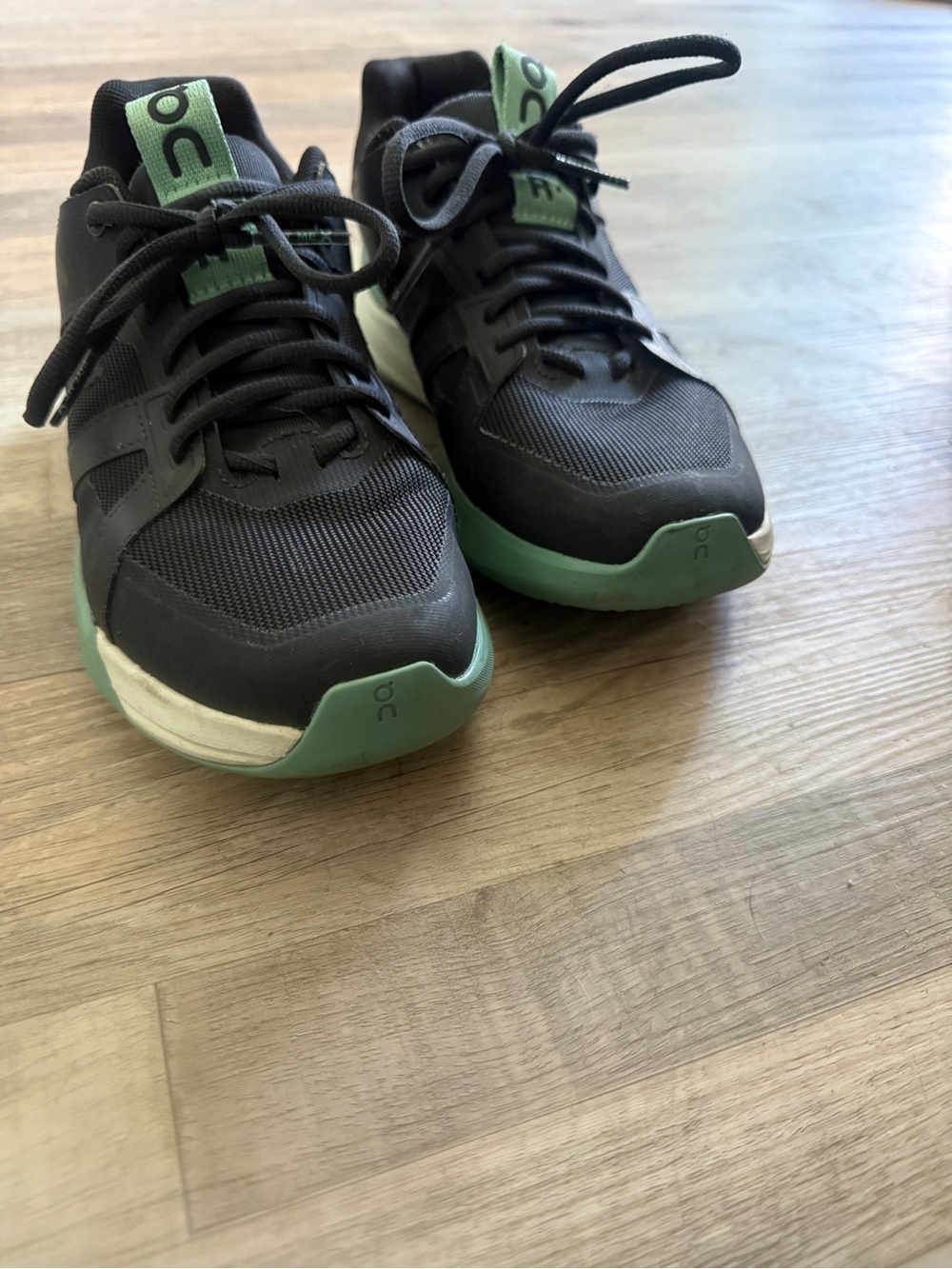 On Running Men’s Black and Mint Green Athletic Trainers